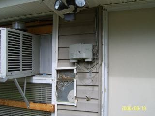 Electrician installing a new exterior meter socket